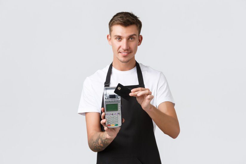 retail-business-cafe-restaurant-employees-concept-friendly-polite-handsome-waiter-giving-pos-terminal-client-paying-coffee-with-credit-card-smiling-cheerfully-white-background_1258-59272.jpg